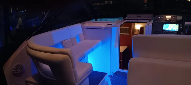 Indeed Yacht Photos Pics 2005 Tiara Yachts 2900 Open interior with blue ambient lighting and modern seating.