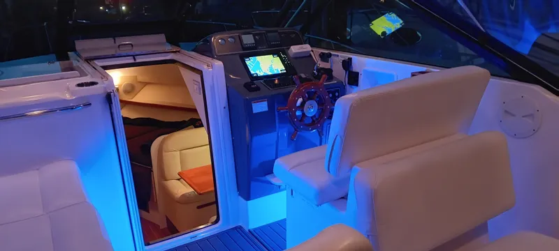 Indeed Yacht Photos Pics 2005 Tiara Yachts 2900 Open interior with illuminated cockpit and cabin view.