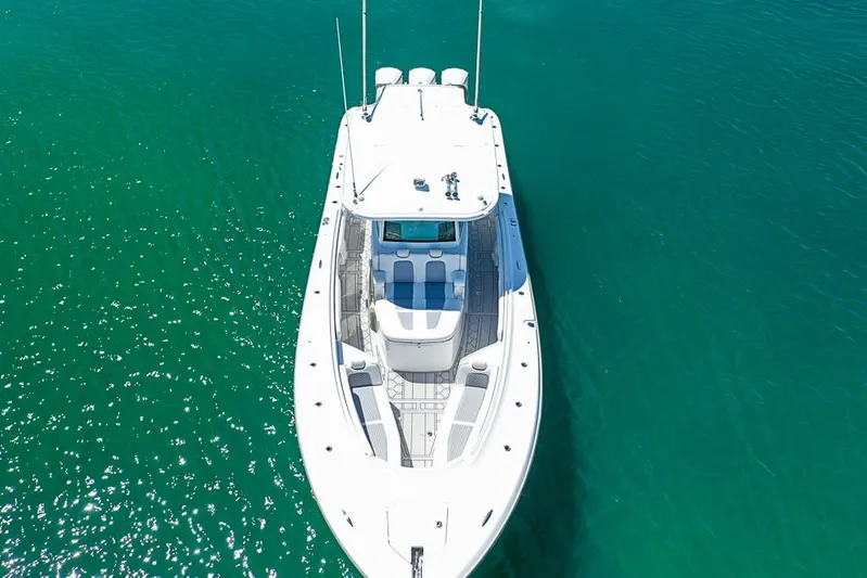  Yacht Photos Pics 2019 HCB 39 Speciale boat on clear turquoise water, aerial view.