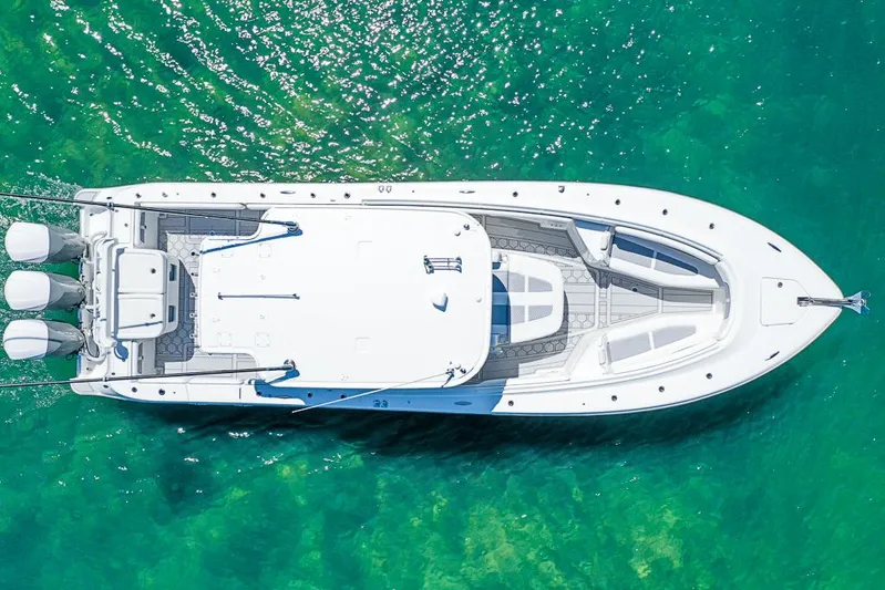  Yacht Photos Pics Aerial view of 2019 HCB 39 Speciale yacht on clear turquoise water.