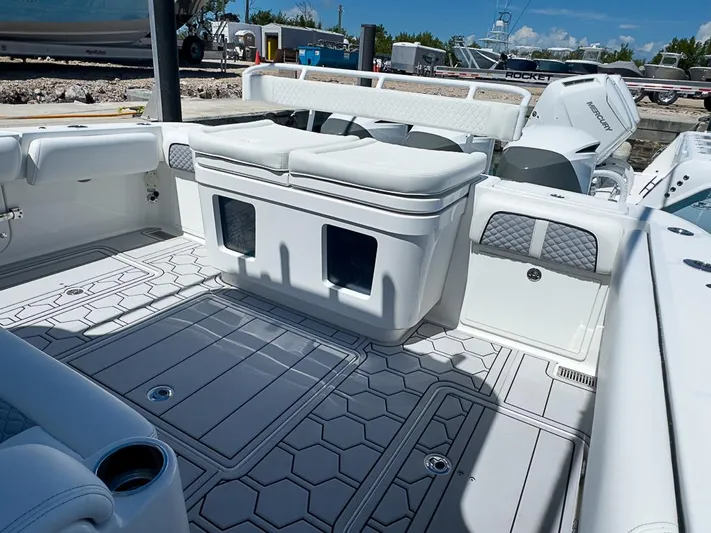  Yacht Photos Pics 2019 HCB 39 Speciale boat interior with cushioned seating and modern design.