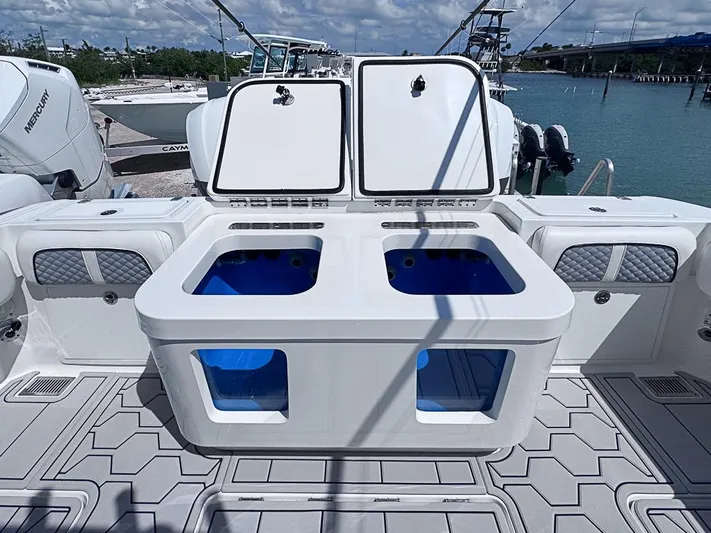  Yacht Photos Pics 2019 HCB 39 Speciale boat deck with storage compartments and seating.