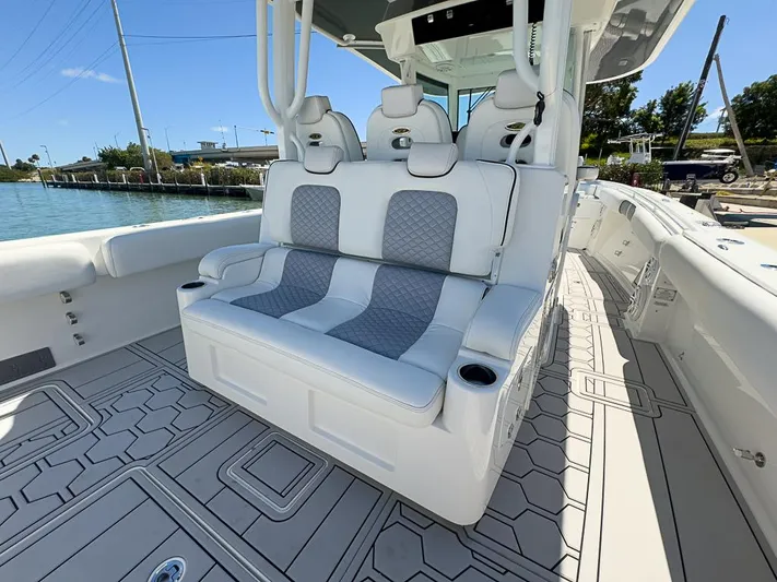  Yacht Photos Pics 2019 HCB 39 Speciale boat interior with cushioned seating and modern design.