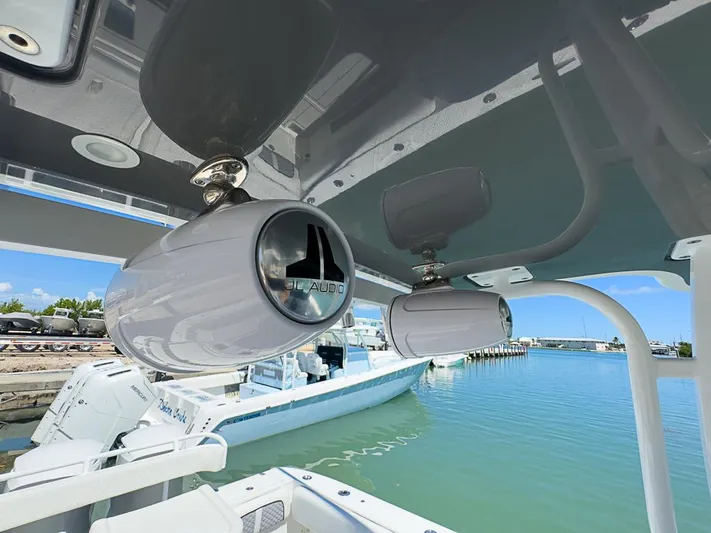  Yacht Photos Pics 2019 HCB 39 Speciale boat with JL Audio speakers, docked by a marina.