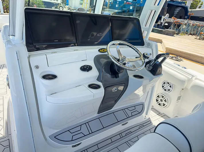  Yacht Photos Pics 2019 HCB 39 Speciale boat helm with modern controls and multiple displays.