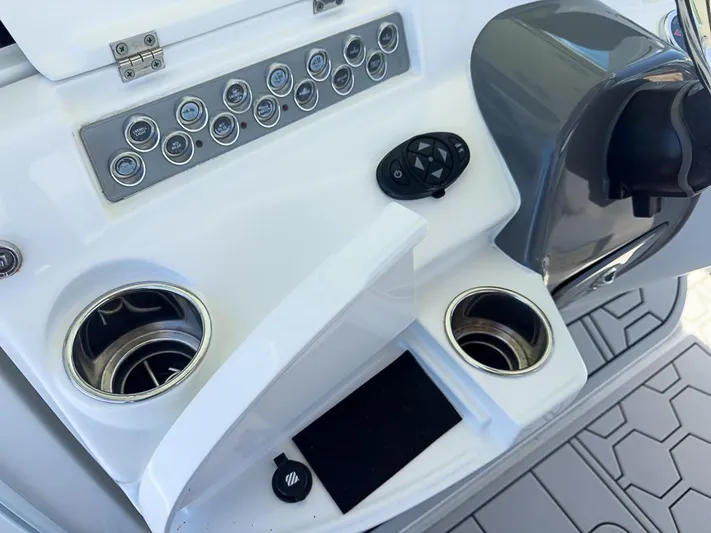  Yacht Photos Pics Control panel of 2019 HCB 39 Speciale boat with cup holders and switches.