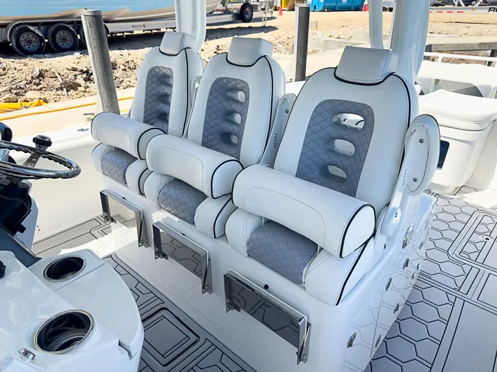  Yacht Photos Pics Luxury seating on 2019 HCB 39 Speciale boat, featuring three cushioned seats.