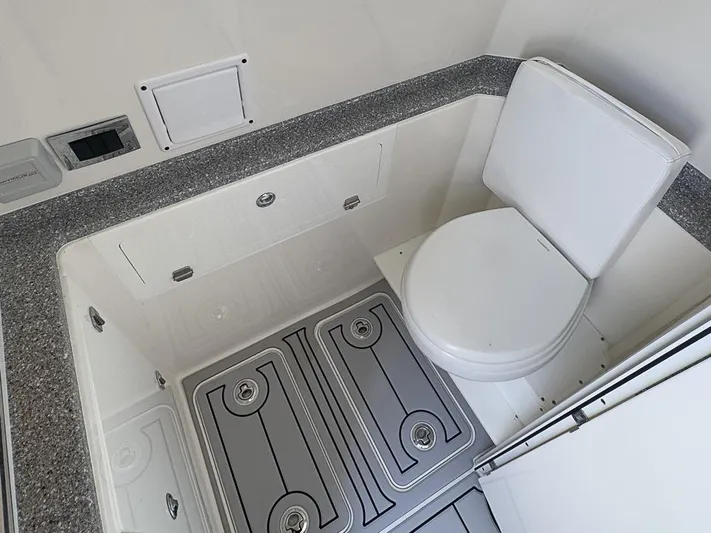  Yacht Photos Pics 2019 HCB 39 Speciale boat bathroom with modern toilet and storage compartments.