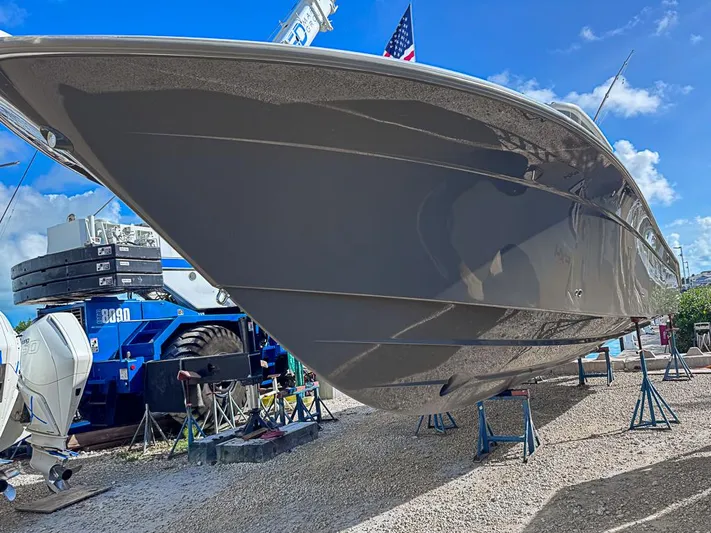  Yacht Photos Pics 2019 HCB 39 Speciale boat on stands, under clear blue sky.
