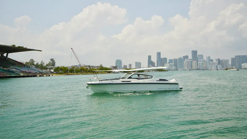 In-stock 2024 Nimbus W9 #279 Yacht Photos Pics 2024 Nimbus Weekender 9 #279 boat cruising near a city skyline.