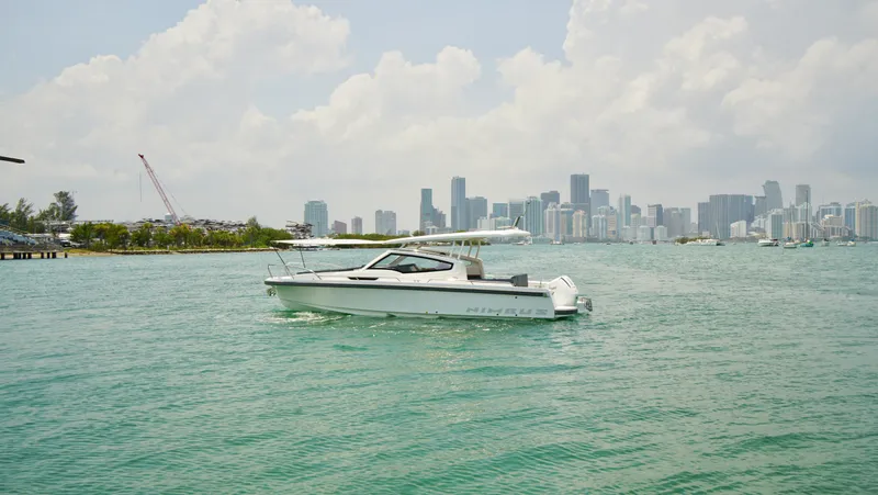 In-stock 2024 Nimbus W9 #279 Yacht Photos Pics 2024 Nimbus Weekender 9 #279 boat cruising near city skyline.