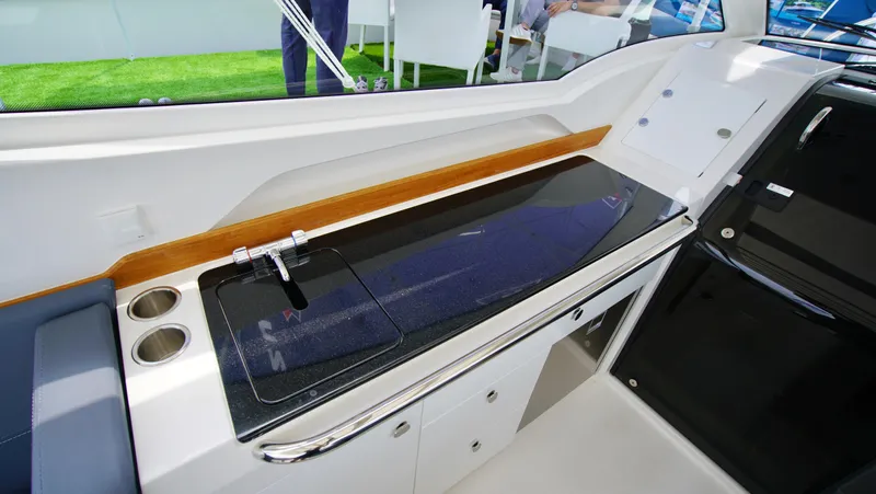 In-stock 2024 Nimbus W9 #279 Yacht Photos Pics 2024 Nimbus Weekender 9 #279 boat interior with sleek kitchen counter and storage.