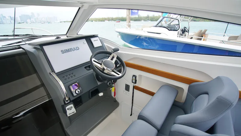 In-stock 2024 Nimbus W9 #279 Yacht Photos Pics Interior helm of 2024 Nimbus Weekender 9 #279 with Simrad navigation system.