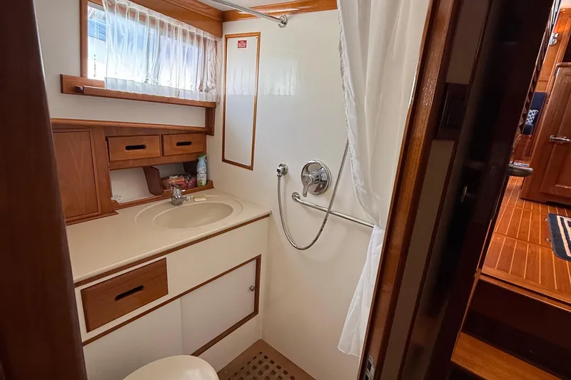 Revere Yacht Photos Pics Bathroom interior of 2002 Grand Banks 42 Classic yacht, featuring sink and shower.