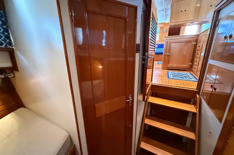 Revere Yacht Photos Pics Interior of 2002 Grand Banks 42 Classic yacht, featuring wooden cabinetry and stairs.