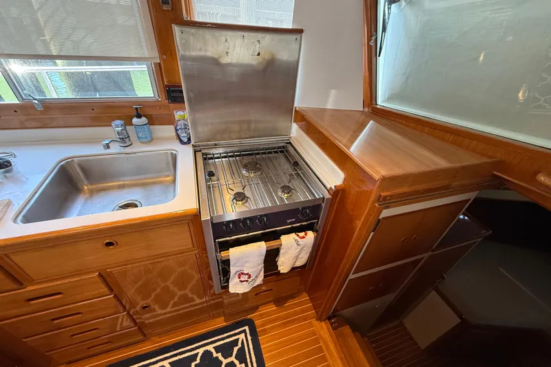 Revere Yacht Photos Pics Galley kitchen in 2002 Grand Banks 42 Classic yacht with stove and sink.