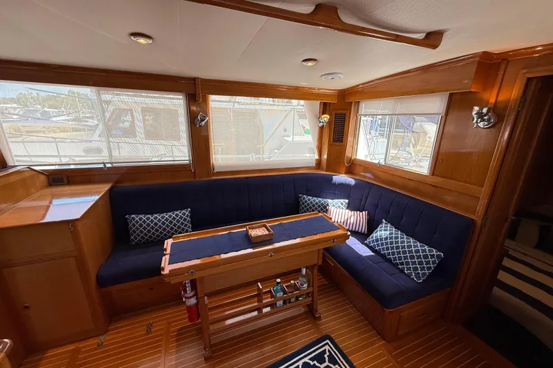 Revere Yacht Photos Pics Interior of 2002 Grand Banks 42 Classic yacht with cozy seating and wooden accents.