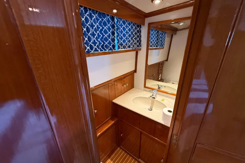 Revere Yacht Photos Pics Luxurious bathroom interior of 2002 Grand Banks 42 Classic yacht with wooden cabinetry.