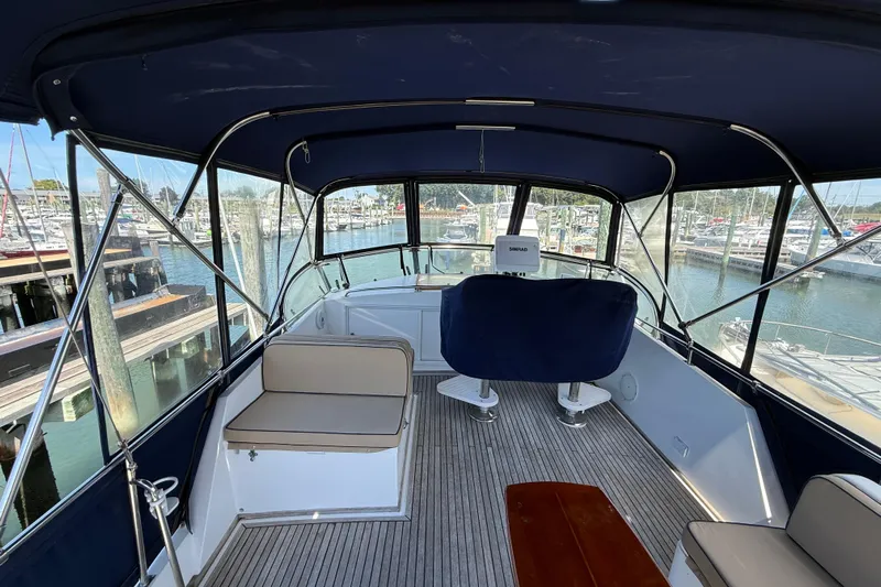 Revere Yacht Photos Pics Flybridge of 2002 Grand Banks 42 Classic yacht, featuring seating and helm, docked at marina.