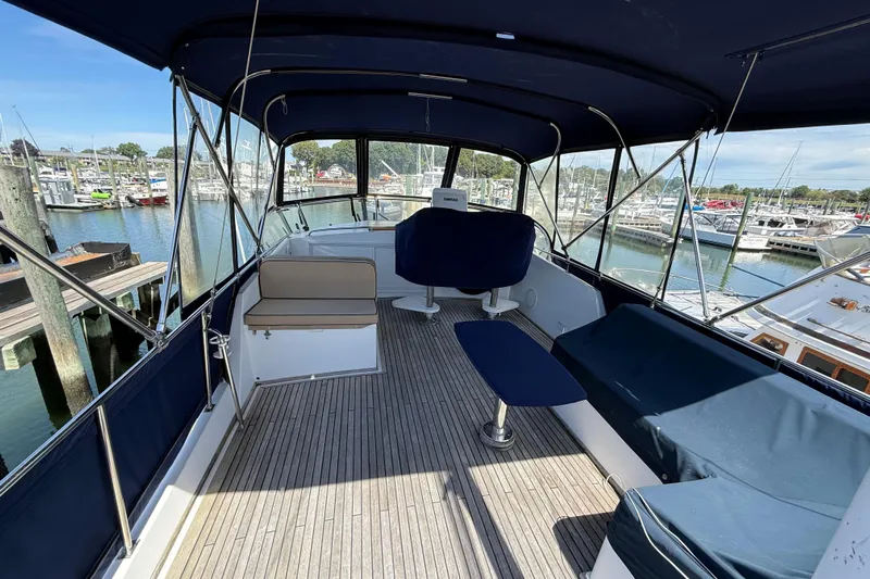 Revere Yacht Photos Pics Flybridge of 2002 Grand Banks 42 Classic yacht with seating, docked at marina.