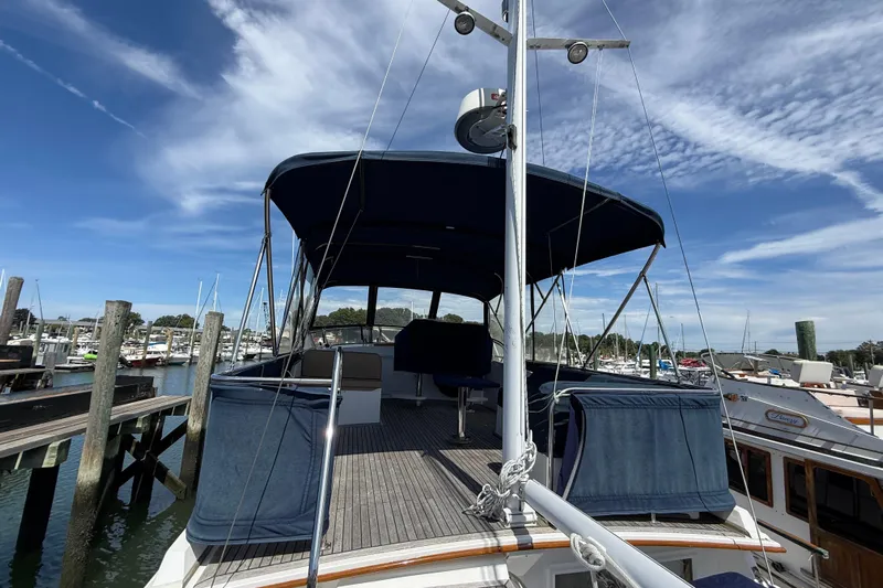 Revere Yacht Photos Pics 2002 Grand Banks 42 Classic yacht docked at marina under clear blue sky.
