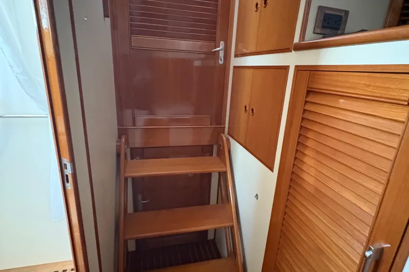 Revere Yacht Photos Pics Interior of 2002 Grand Banks 42 Classic yacht with wooden stairs and cabinetry.