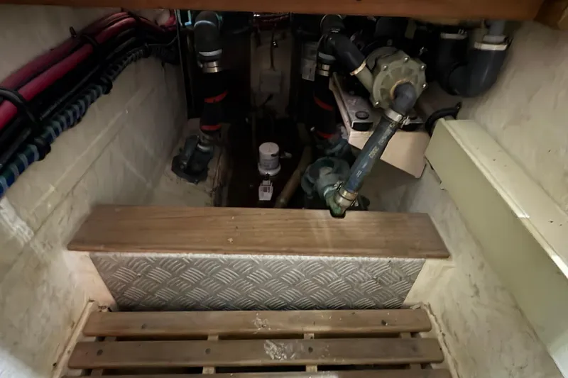 Revere Yacht Photos Pics Engine room of 2002 Grand Banks 42 Classic yacht, showing pipes and mechanical components.