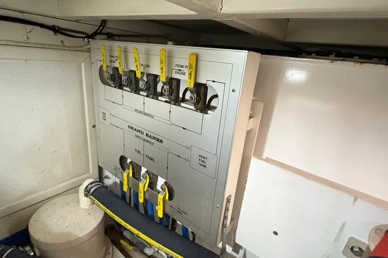 Revere Yacht Photos Pics Engine room fuel panel of 2002 Grand Banks 42 Classic yacht with labeled valves.