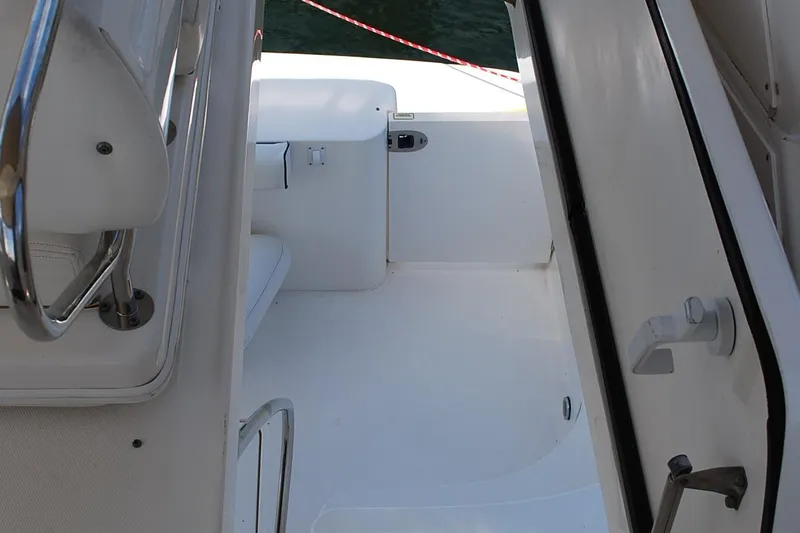  Yacht Photos Pics 2004 Sea Ray Sedan Bridge boat interior with white seating and railing.