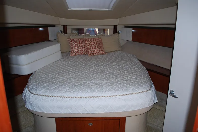  Yacht Photos Pics Luxurious 2004 Sea Ray Sedan Bridge cabin with cozy bed and elegant decor.