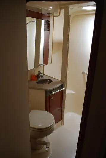  Yacht Photos Pics 2004 Sea Ray Sedan Bridge bathroom with sink, mirror, and toilet.