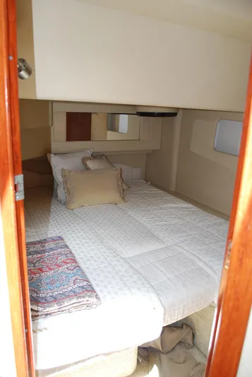  Yacht Photos Pics 2004 Sea Ray Sedan Bridge cabin with cozy bed and elegant decor.