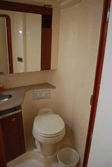  Yacht Photos Pics 2004 Sea Ray Sedan Bridge bathroom with toilet, sink, and mirror.