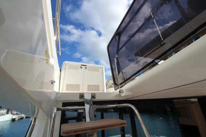  Yacht Photos Pics Prestige 520 yacht, 2025 model, showcasing sleek design and modern features under a blue sky.