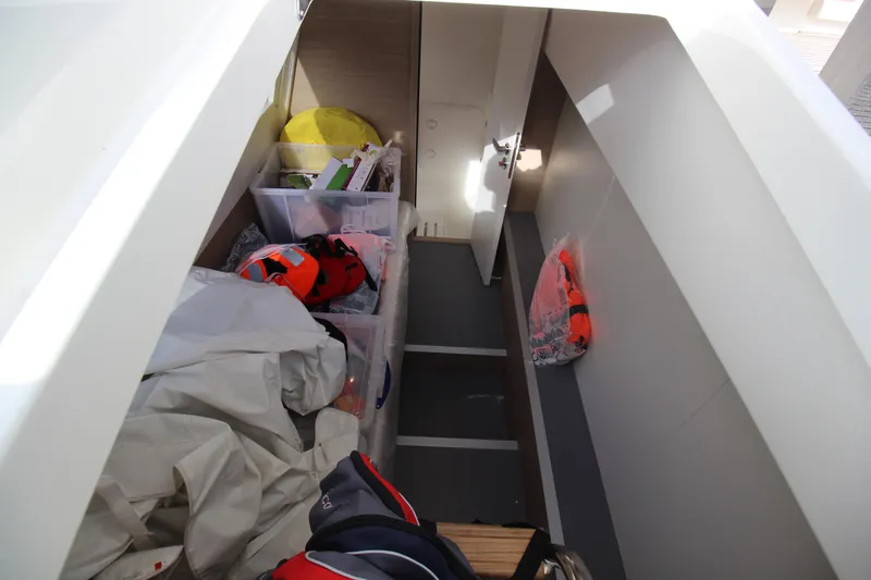  Yacht Photos Pics Storage area inside a 2025 Prestige 520 yacht with life jackets and equipment.