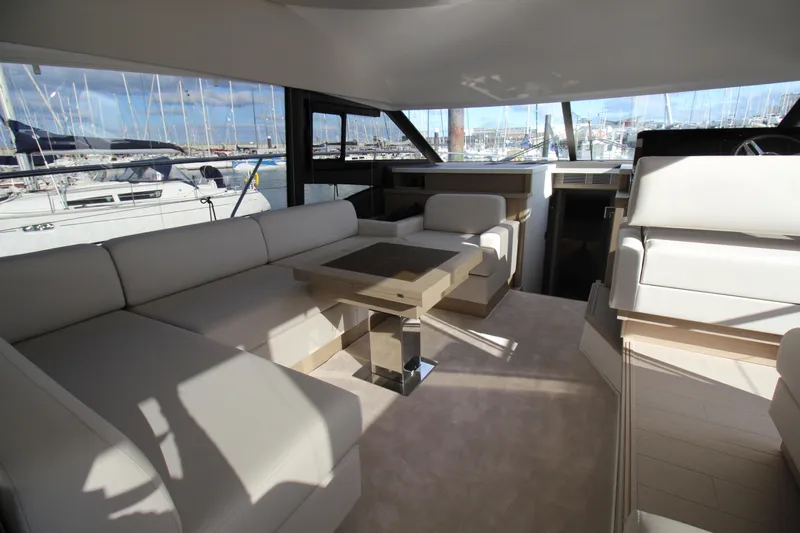  Yacht Photos Pics Luxurious interior of 2025 Prestige 520 yacht with elegant seating and modern design.