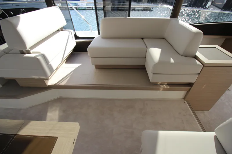  Yacht Photos Pics Luxurious interior of 2025 Prestige 520 yacht with elegant white seating and modern design.