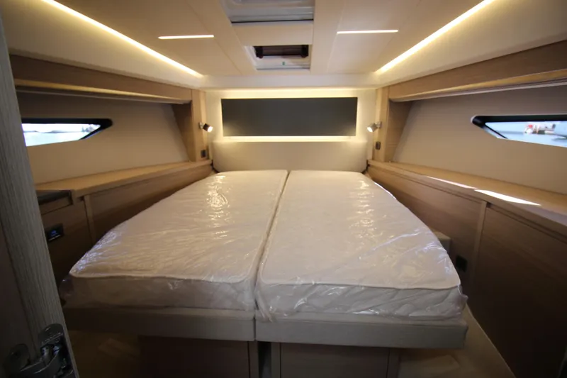  Yacht Photos Pics Luxurious cabin interior of 2025 Prestige 520 yacht with modern lighting and twin beds.