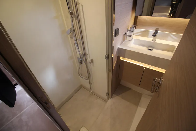  Yacht Photos Pics Modern bathroom in 2025 Prestige 520 yacht with shower and sleek sink design.