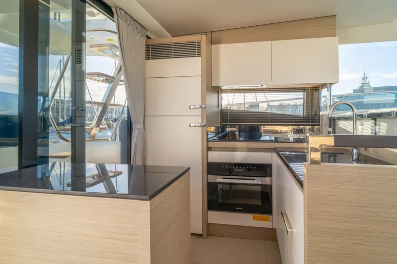  Yacht Photos Pics Modern kitchen interior on 2025 Prestige 520 yacht, featuring sleek design and appliances.