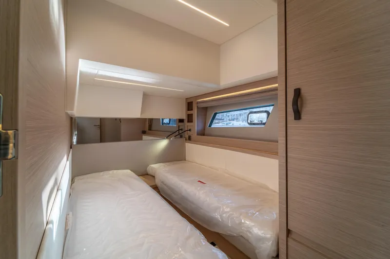  Yacht Photos Pics Luxurious cabin interior of 2025 Prestige 520 yacht with twin beds and modern design.