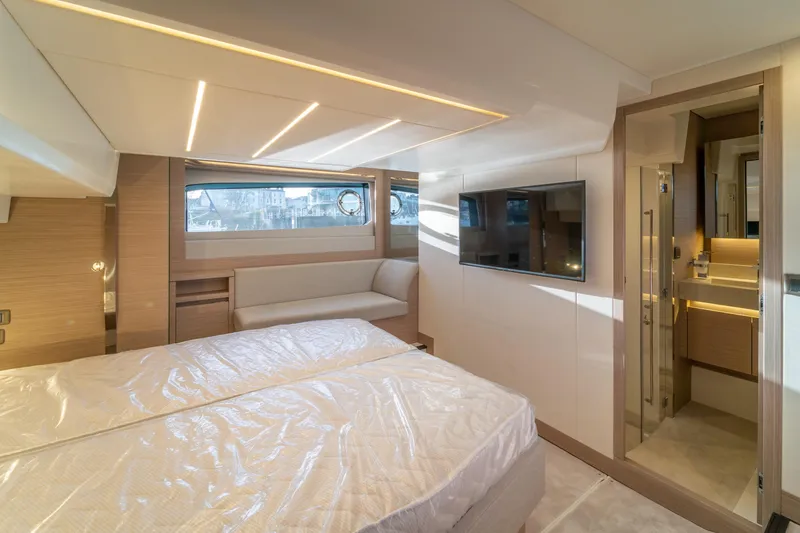  Yacht Photos Pics Luxurious interior of 2025 Prestige 520 yacht with modern bedroom and ensuite bathroom.