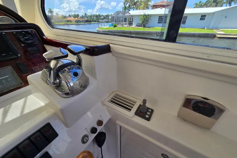 Lady Elizabeth Yacht Photos Pics Control panel of a 2006 Huckins Atlantic 44 yacht with waterway view.