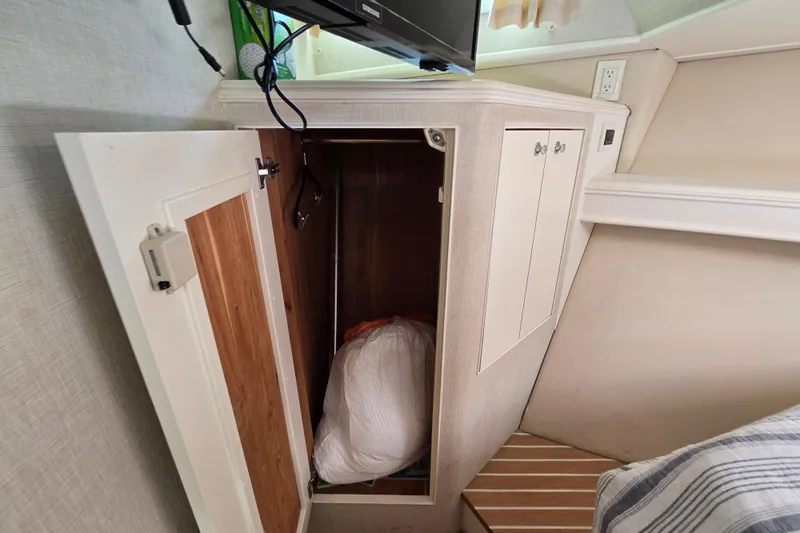 Lady Elizabeth Yacht Photos Pics Open storage cabinet inside 2006 Huckins Atlantic 44 yacht interior.