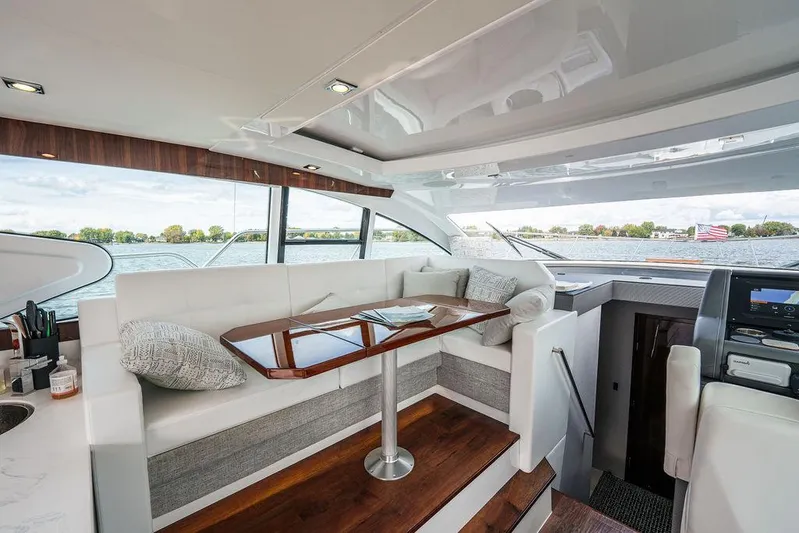  Yacht Photos Pics Luxurious interior of 2023 Cruisers Yachts 46 Cantius with elegant seating and scenic views.