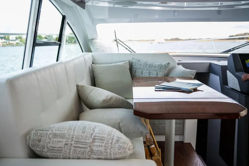  Yacht Photos Pics Luxurious interior of 2023 Cruisers Yachts 46 Cantius with elegant seating and scenic views.