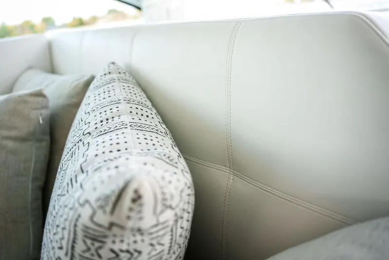  Yacht Photos Pics Luxurious interior of 2023 Cruisers Yachts 46 Cantius with patterned cushions.