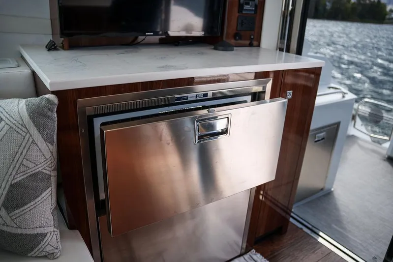  Yacht Photos Pics 2023 Cruisers Yachts 46 Cantius interior with stainless steel drawer and lake view.