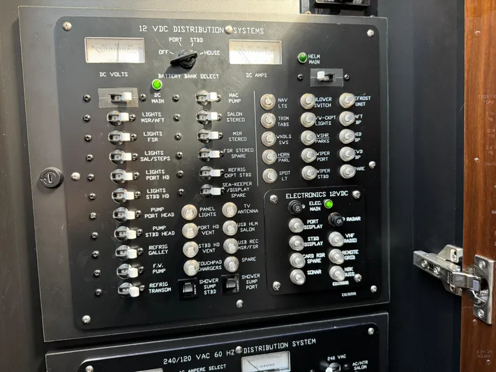  Yacht Photos Pics Electrical control panel on 2023 Cruisers Yachts 46 Cantius, featuring various switches and indicators.