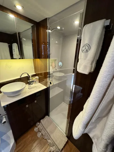  Yacht Photos Pics Luxurious bathroom in 2023 Cruisers Yachts 46 Cantius with modern fixtures and elegant design.